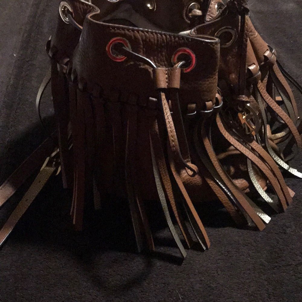 Michael Kors drawstring leather fringe bag .